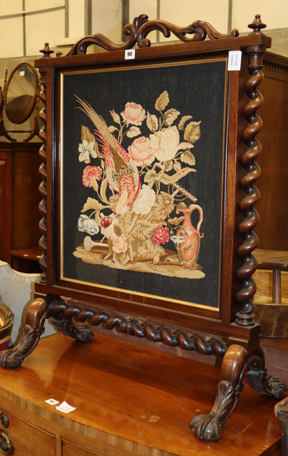 A Victorian rosewood framed fire screen with needlework panel, W.71cm